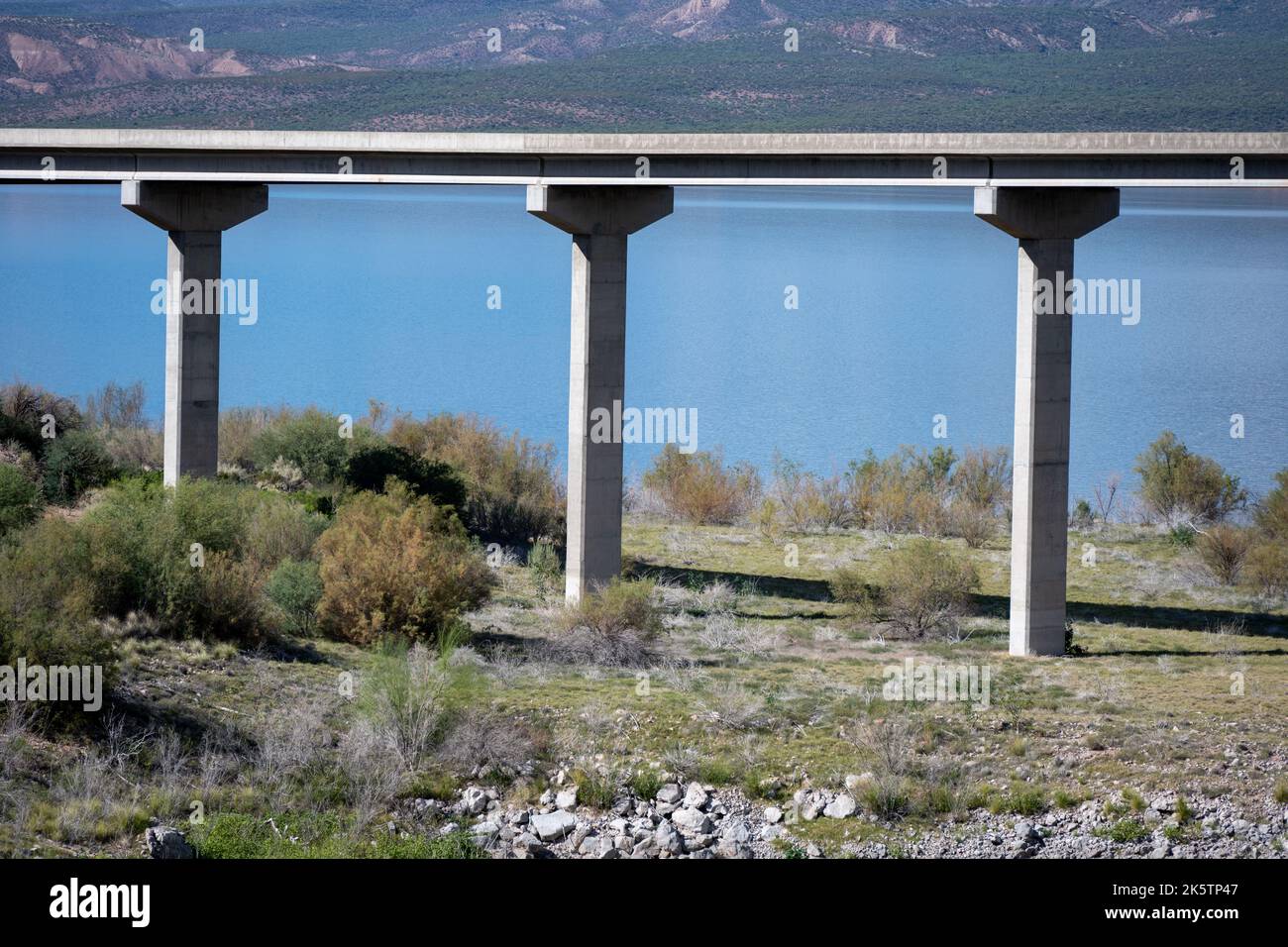 Three pillars supporting a thin steel reenforced concrete bridge Stock Photo