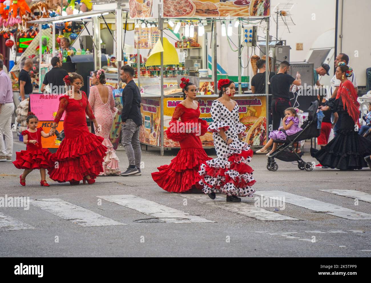 Women in a traditional flamenco dresses during the annual feria in