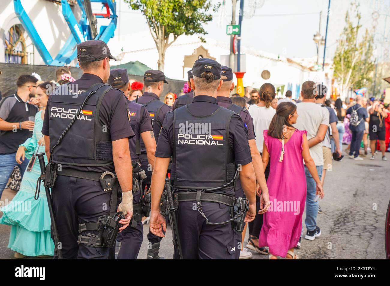 National Spanish police patrolling on annual fair in Fuengirola, Spain. Stock Photo