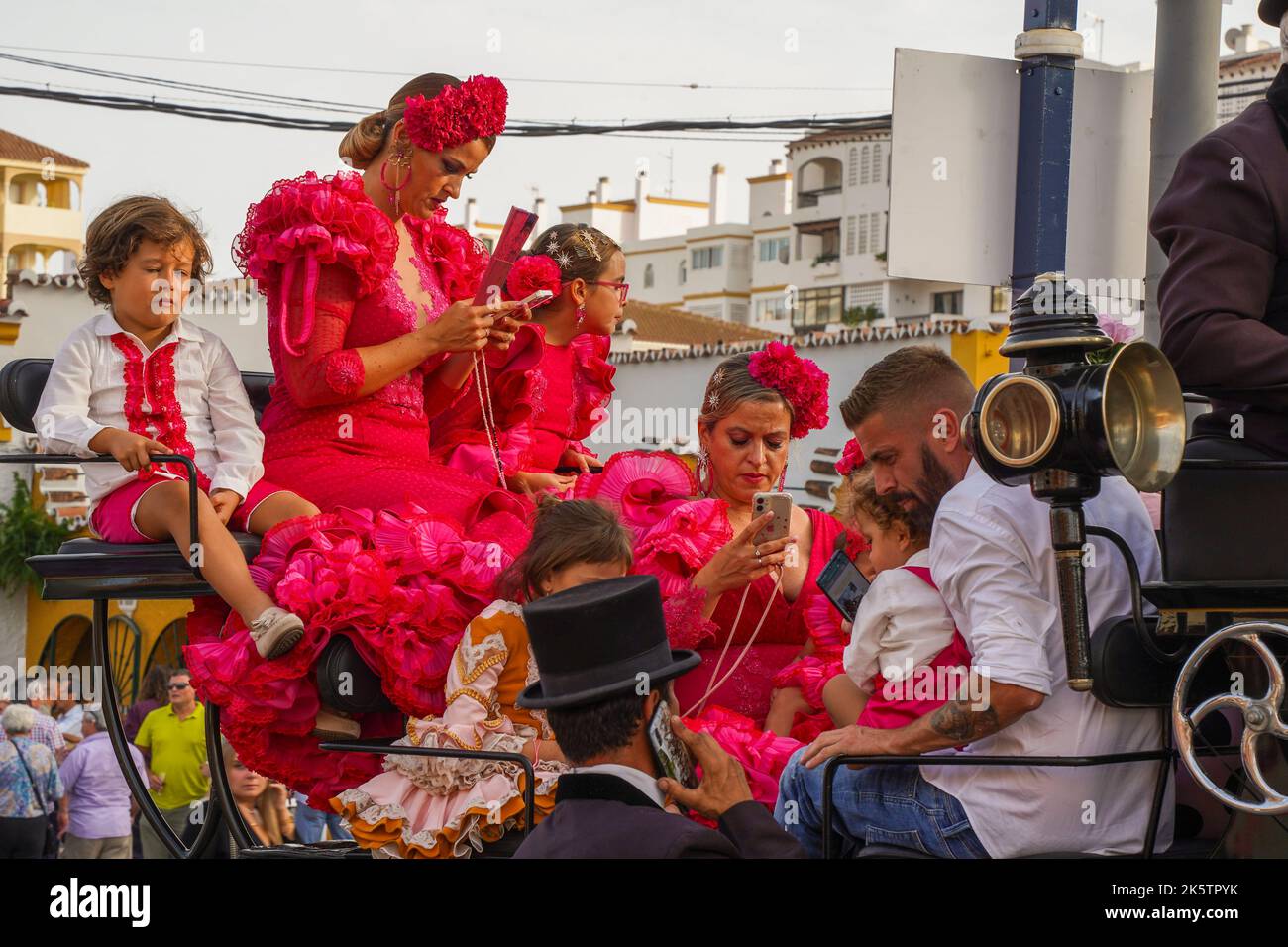 Horse carriage with family in traditional outfit celebrating, at the