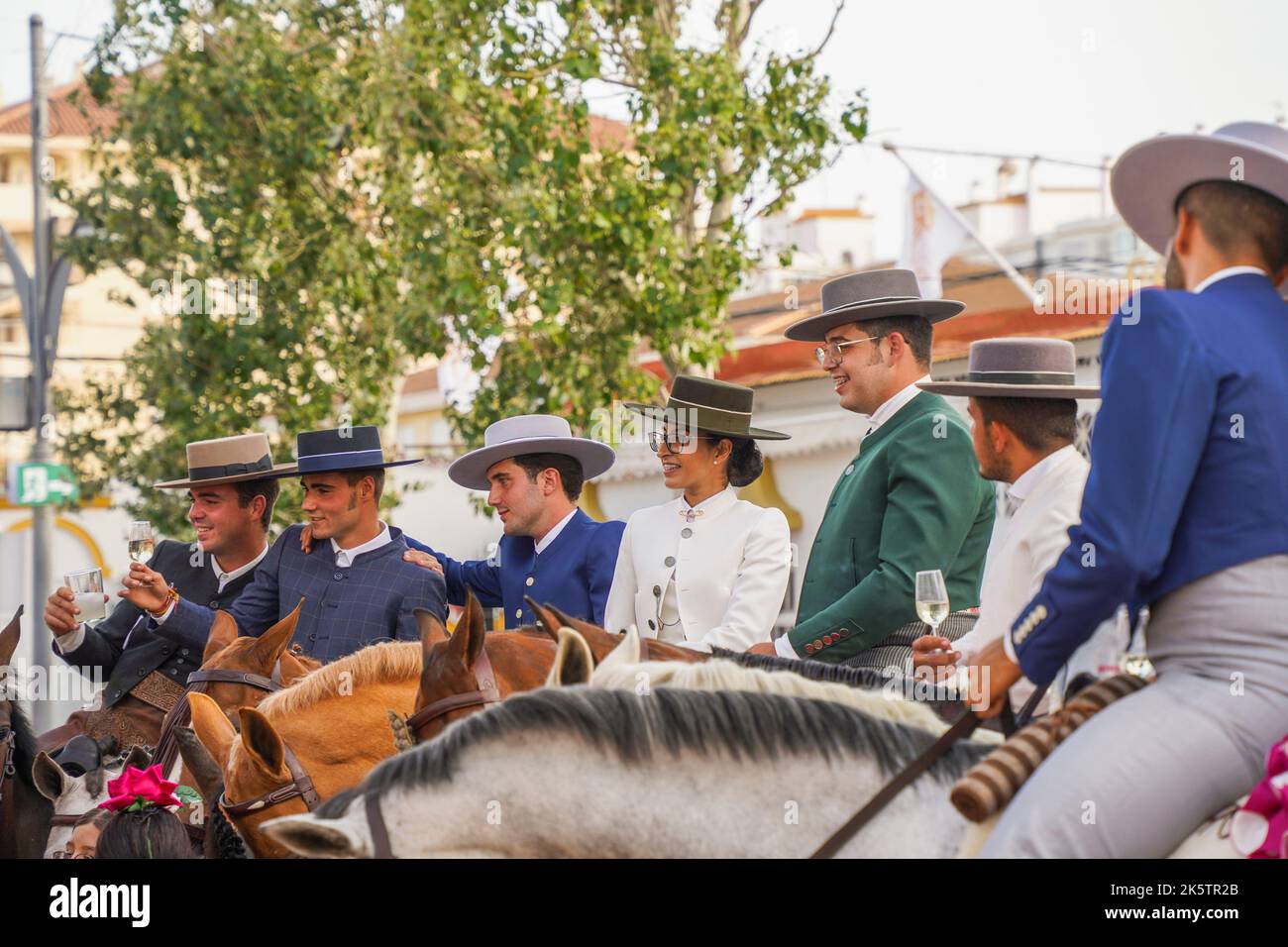 Spanish horsemen and woman at a bar, during annual Fair, Feria. Fuengirola, Andalusia. Stock Photo