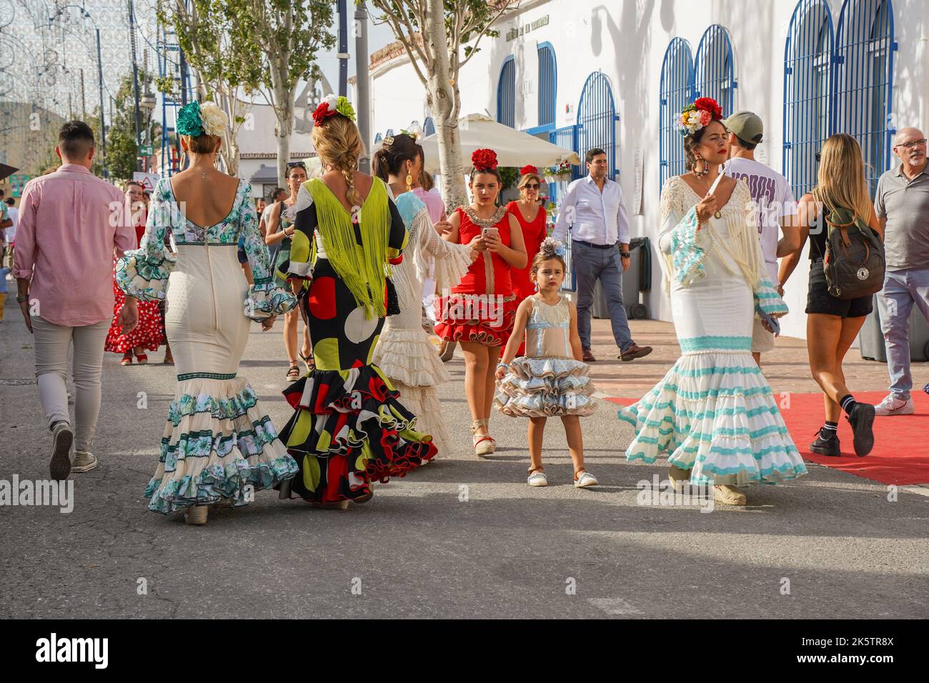 Women in a traditional flamenco dresses during the annual feria in