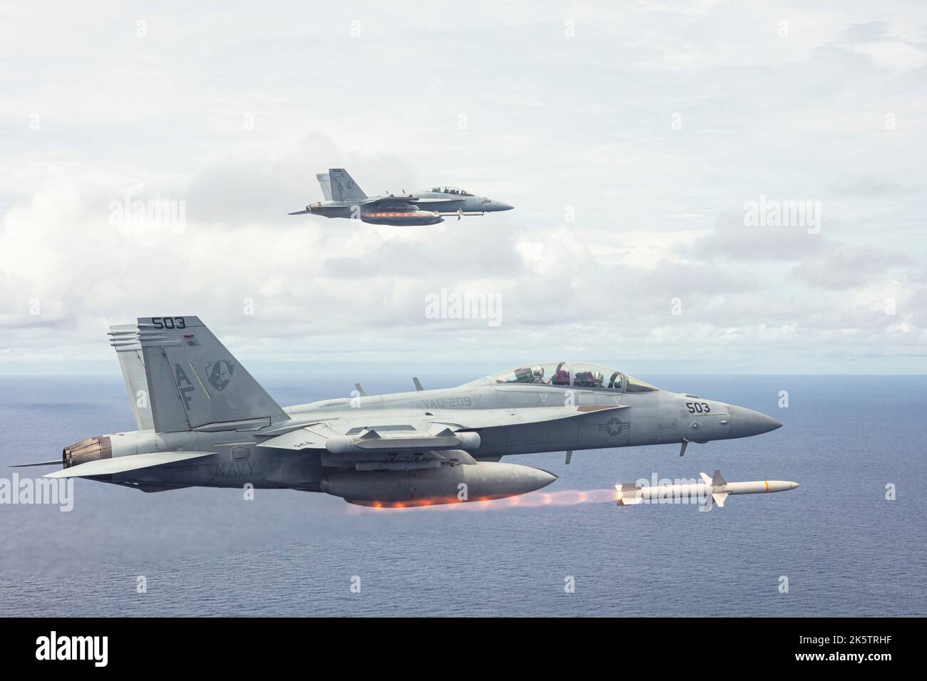 MIRC, United States. 30 August, 2022. U.S. Navy EA-18G Growler fighter aircraft, attached to the Star Warriors of  Electronic Attack Squadron 209, fire AGM-88 High Speed Anti-Radiation Missiles at the Mariana Islands Range Complex, August 30, 2022 near Guam. Stock Photo