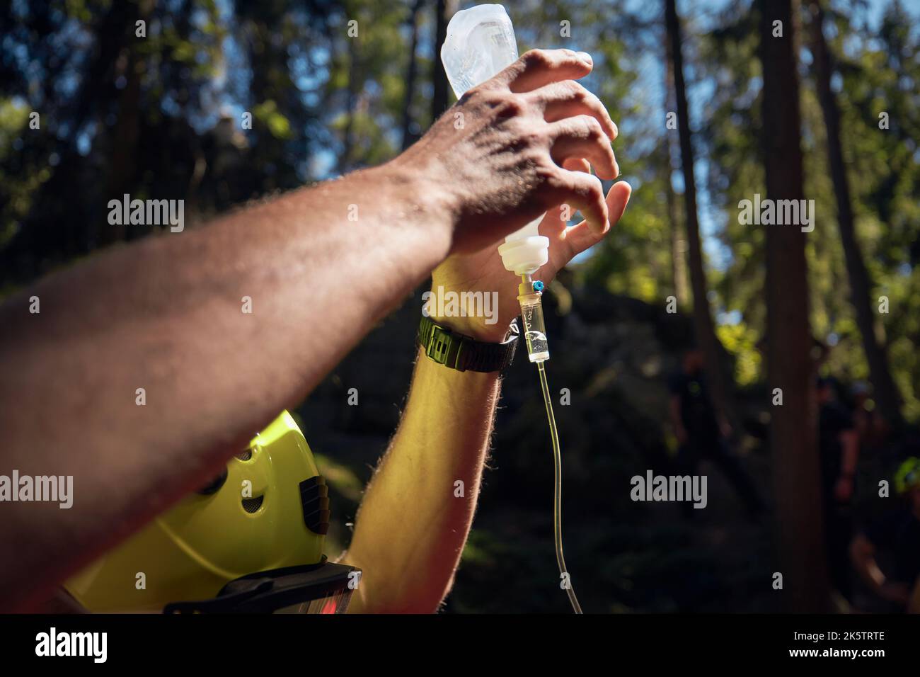 Hands of paramedic holding infusion with medicine. Themes rescue, urgency and health care. Stock Photo