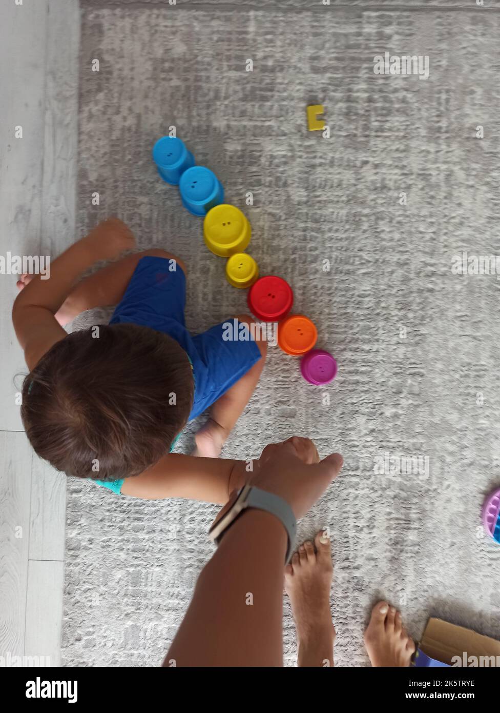 Child playing with colorful Lego and puzzle Stock Photo - Alamy