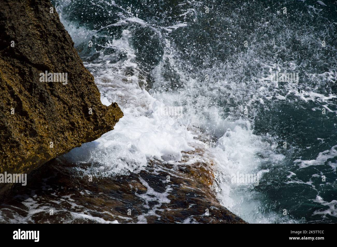 An aerial view of sea waves breaking rocky beach Stock Photo - Alamy