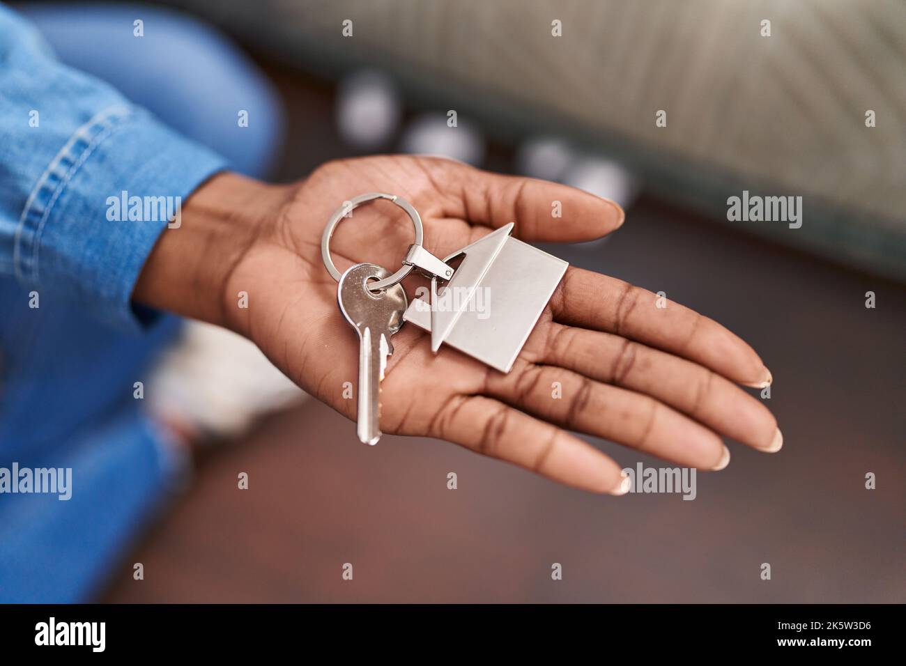 African american woman holding key at new home Stock Photo - Alamy
