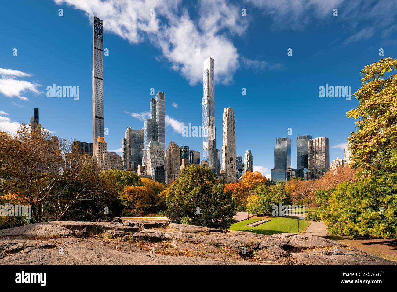 Central Park in Fall with view of the skyscrapers of Billionaires' Row in morning light. Midtown Manhattan, New York City Stock Photo