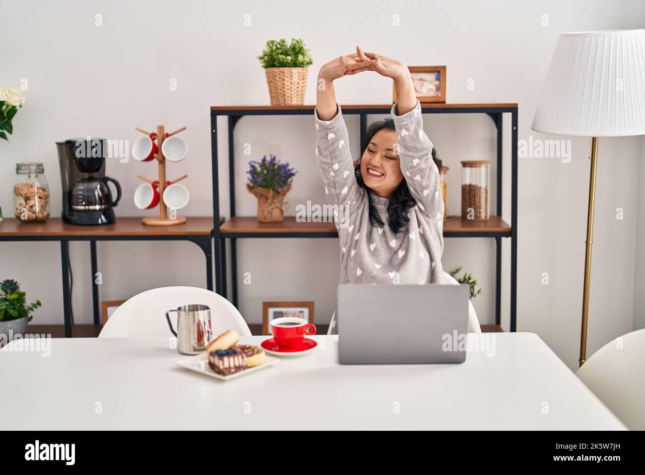 Freelancer stretching arms sitting hi-res stock photography and images ...