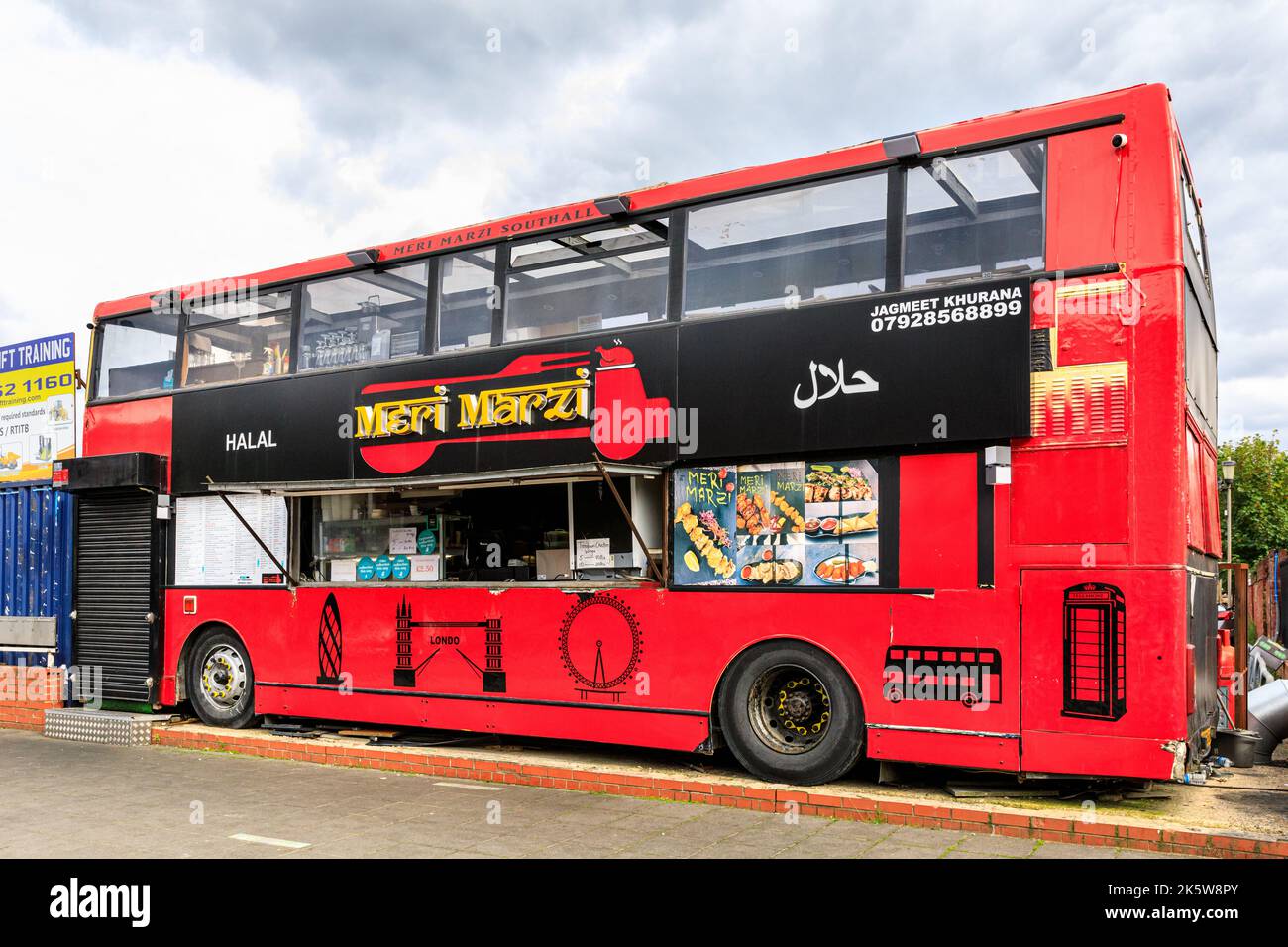 Meri Marzi takeaway and halal kebab fast food from a converted double decker bus, Southall, London Stock Photo