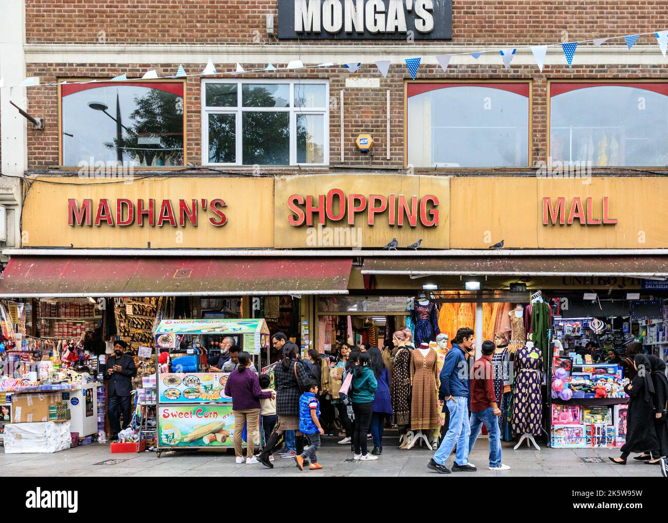 Madhan's Shopping Mall stores, Asian shops and people shopping in Southall High Street, Southall, West London, England, UK Stock Photo