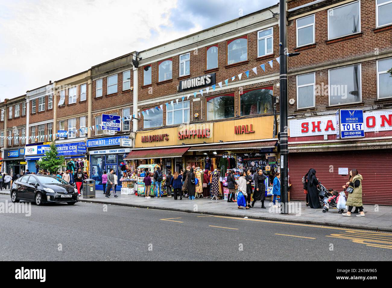Punjabi, Indian and Asian shops and people shopping in Southall High Street, Southall, West London, England, UK Stock Photo