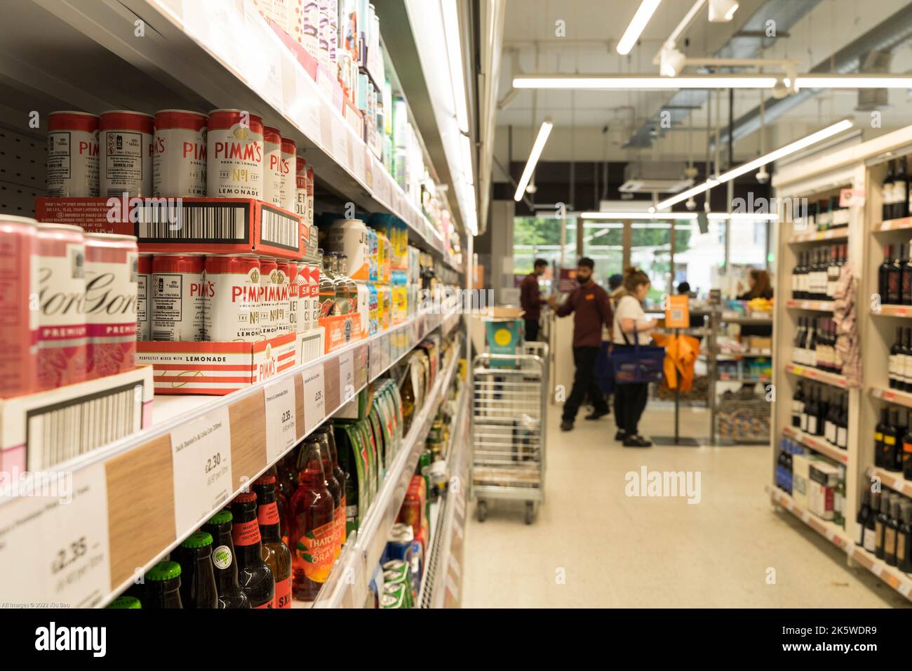 Alcohol aisle, with PIMM's on shelves at Sainsbury's supermarket