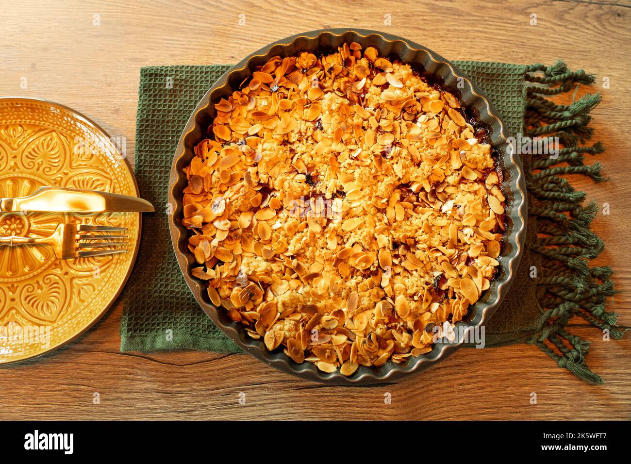 autumn stlye crumble cake flat lay with almond slices Stock Photo