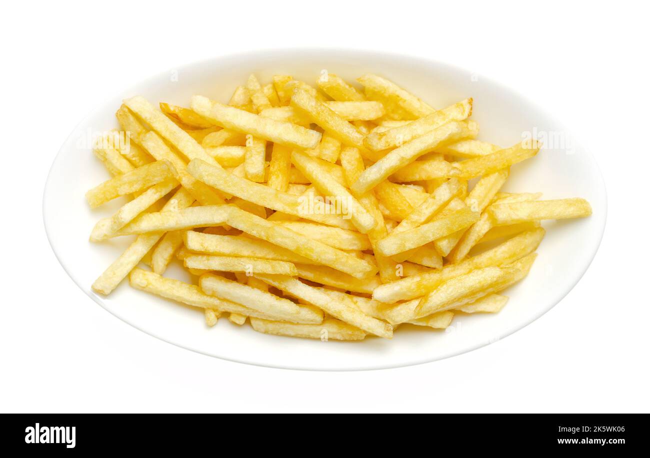 Salted potato sticks in a white bowl, from above. Also called shoestring potatoes, a popular snack and variant of crispy potato chips. Stock Photo