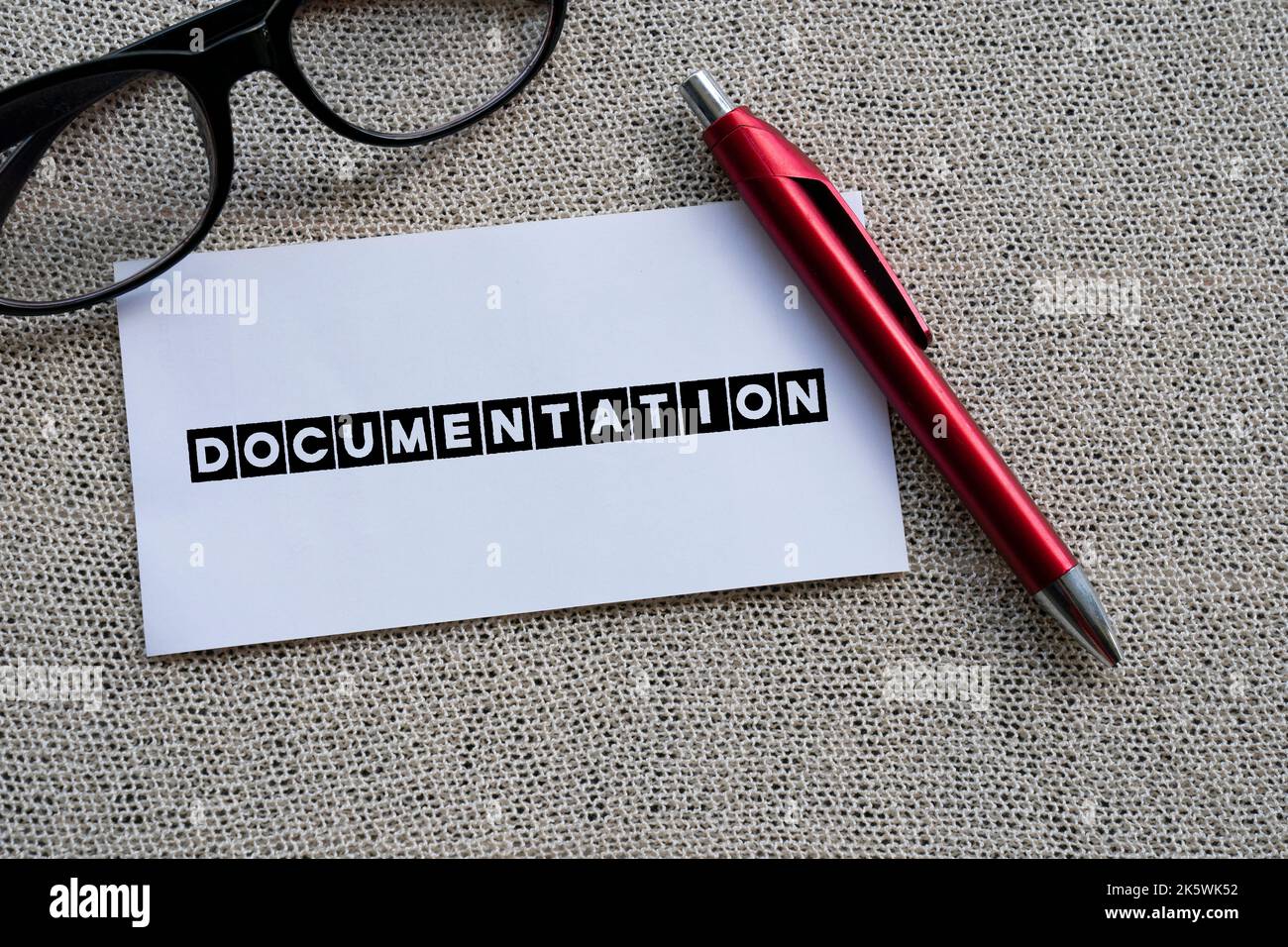 The word DOCUMENTATION on white paper with a red pen Stock Photo