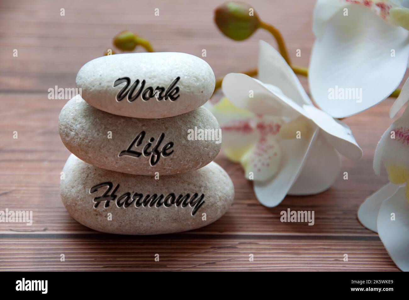 Work life harmony text engraved on stones. New ways of working culture ...
