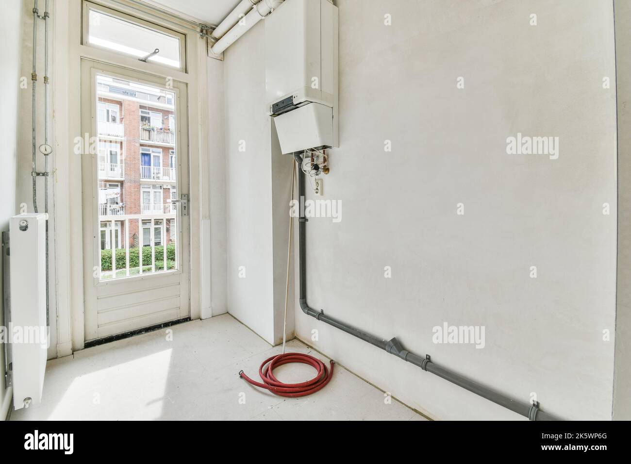 Boiler room of an apartment building with pipes and metering devices. A