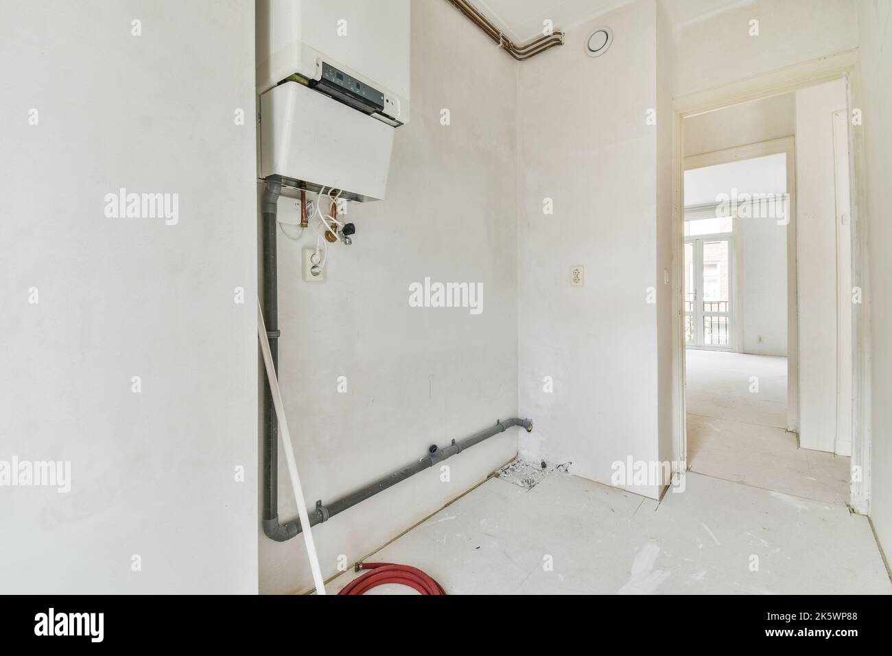 Boiler room of an apartment building with pipes and metering devices. A