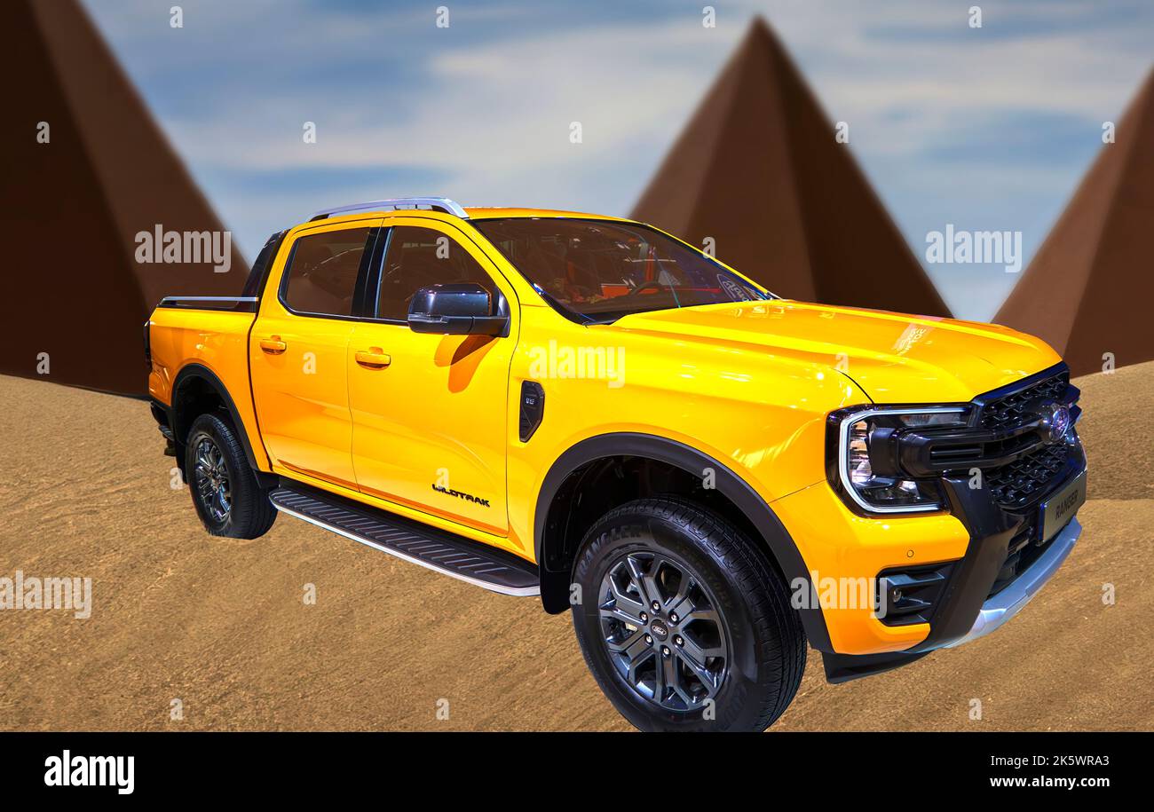 Ford Ranger wildtrak pickup off-road vehicle, composite in oblique view in front of stylized blurred pyramids in sand, Hannover, Germany, September 24 Stock Photo
