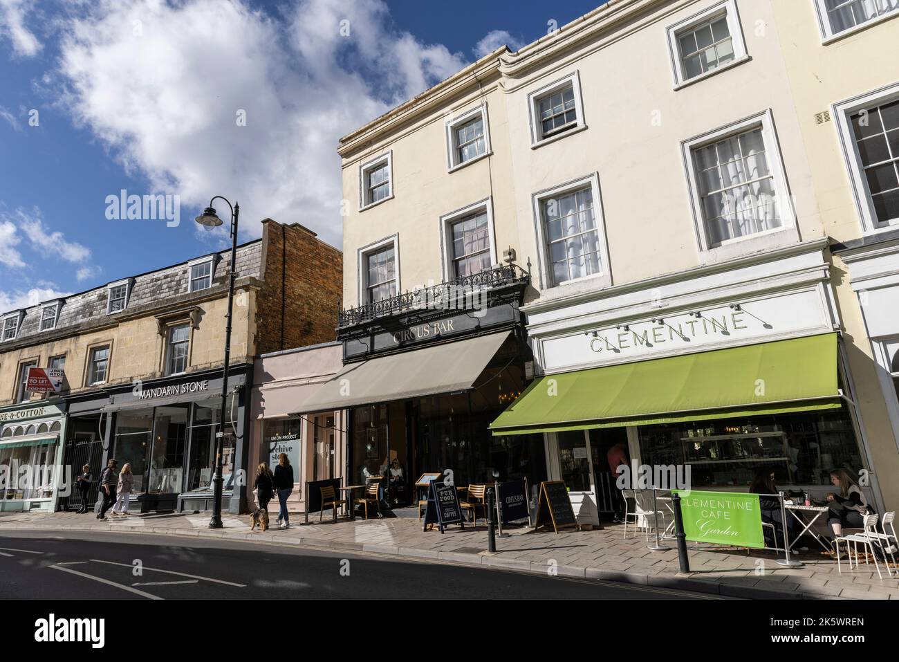 Clementine cafe (green awning) situated on Queen's Circus in Cheltenham