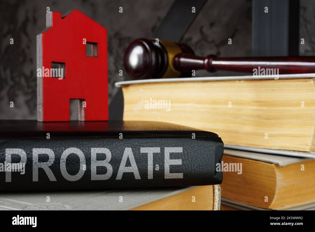 Probate law book and model of house on it. Stock Photo