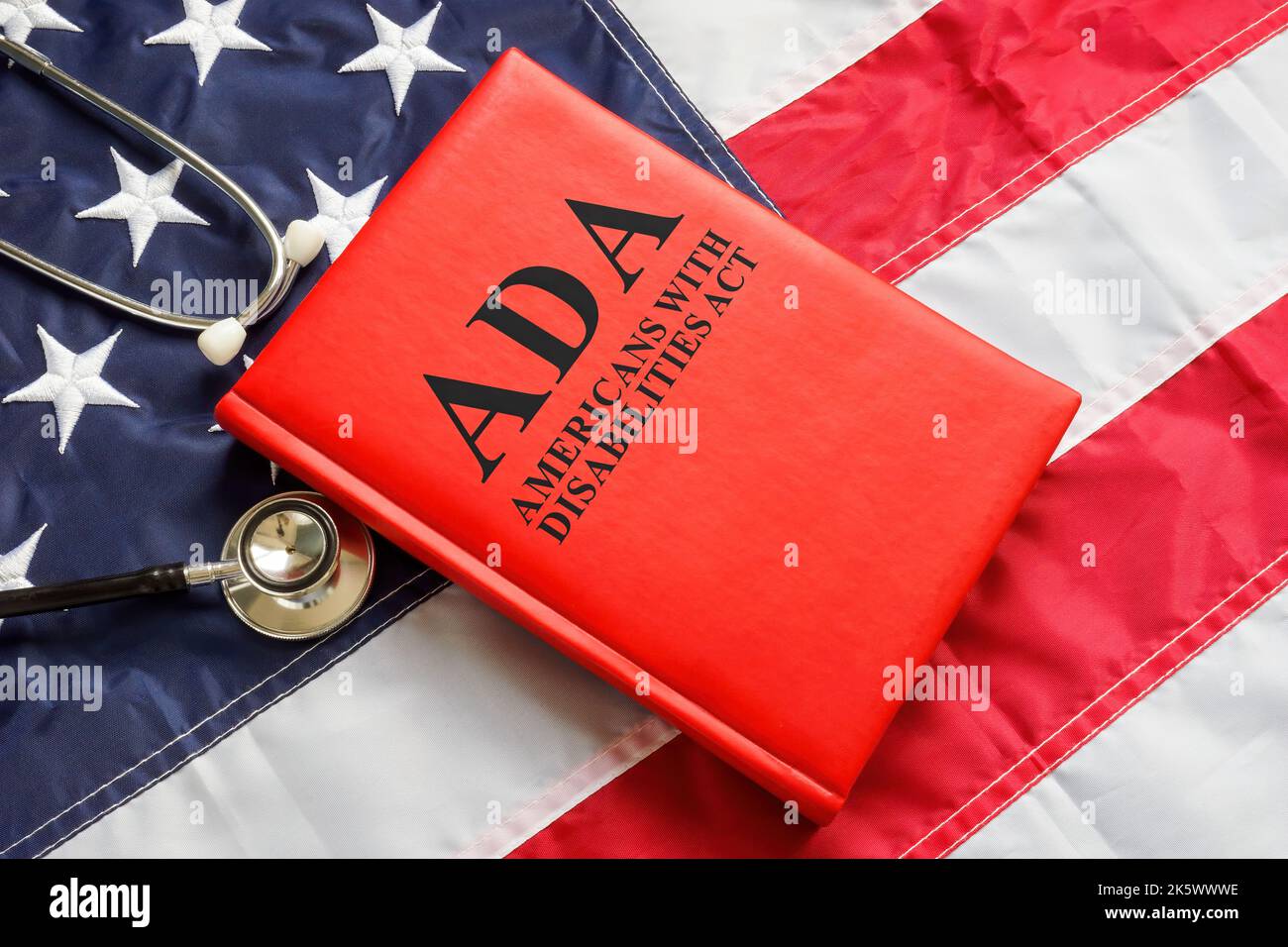 American flag, book The Americans with Disabilities Act ADA law and stethoscope. Stock Photo