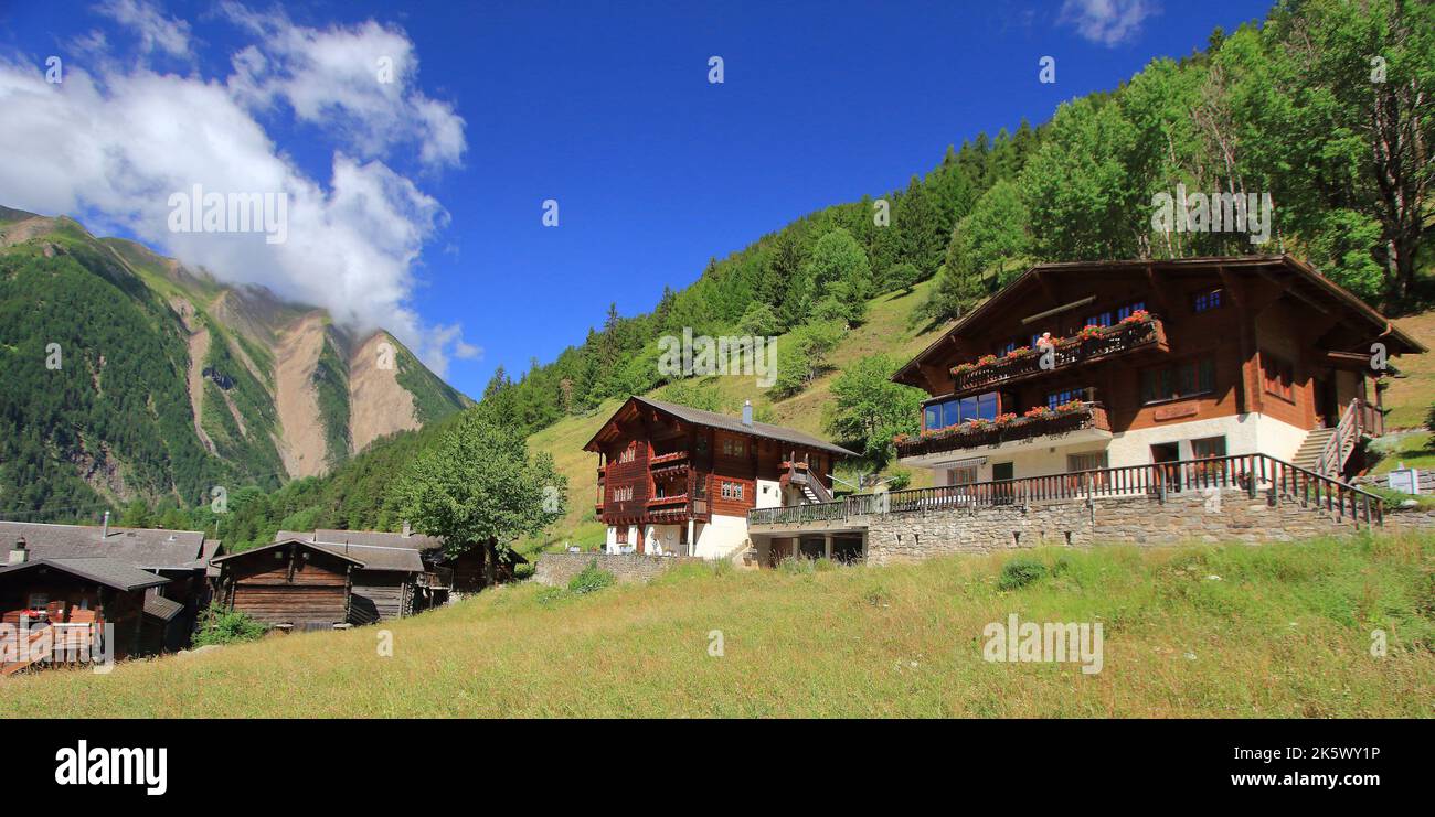 Traditional wooden swiss houses in the Alps mountain, Binn, Binntal, in the canton of Valais in Switzerland Stock Photo