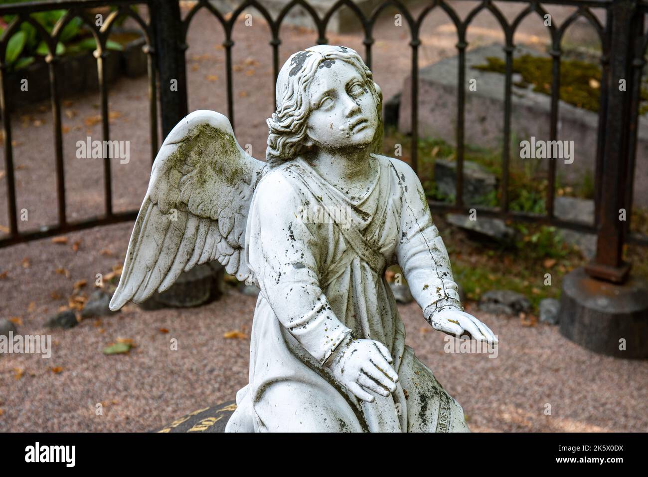 Funerary art angel sculpture on a grave stone in Hietaniemi cemetery in