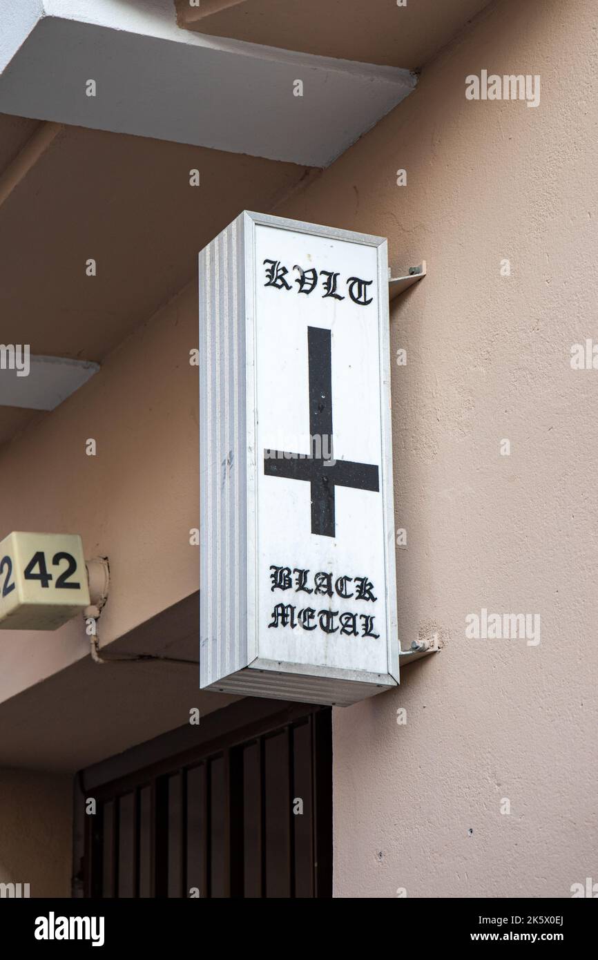 KVLT Black Metal record shop sign with inverted cross in Punavuori dsitrict of Helsinki, Finland Stock Photo