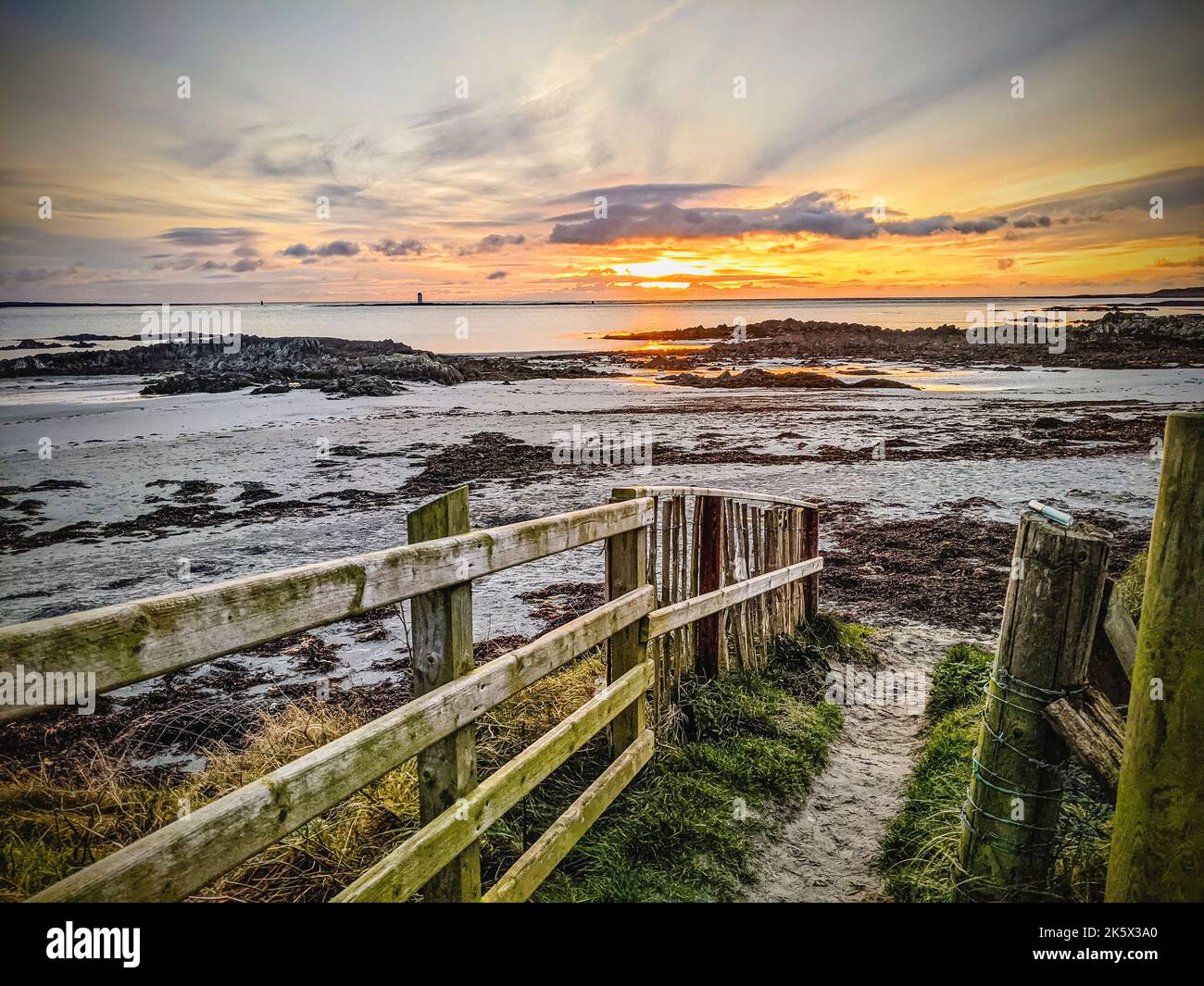Sunrise at Kilclief Beach, a very popular beach for sea swimmers, wind surfers and stand-up paddleboarders.  County Down, Northern Ireland, United Kingdom, UK Stock Photo