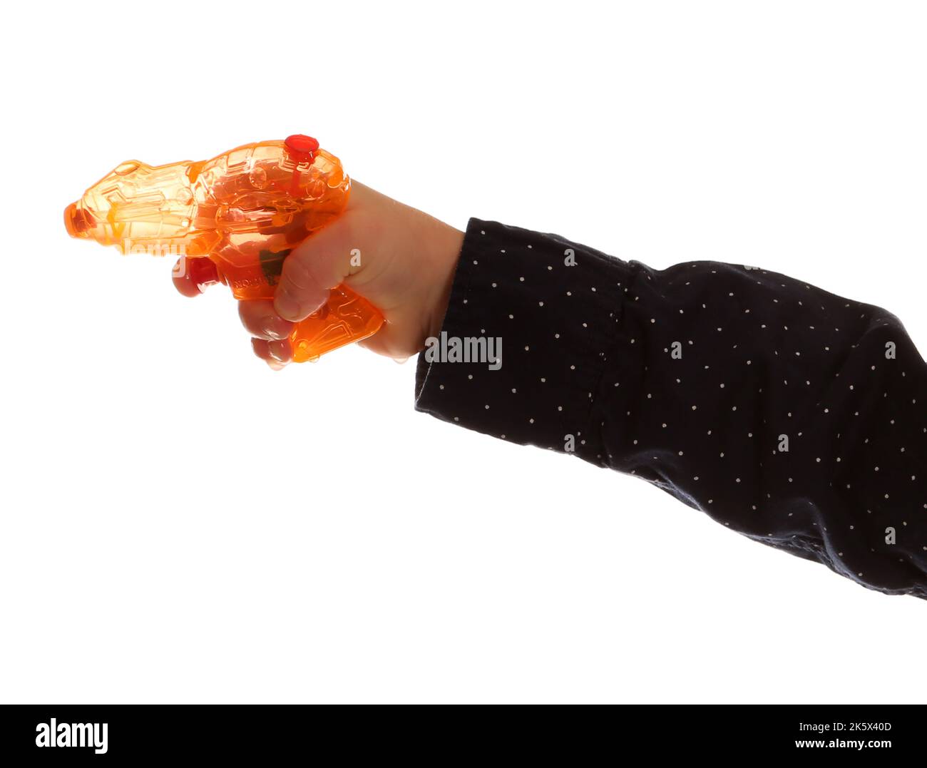 Child holding a water pistol on a white background Stock Photo