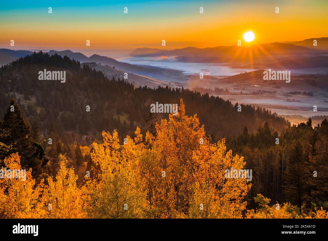 autumn sunrise over the tenmile creek valley below macdonald pass near