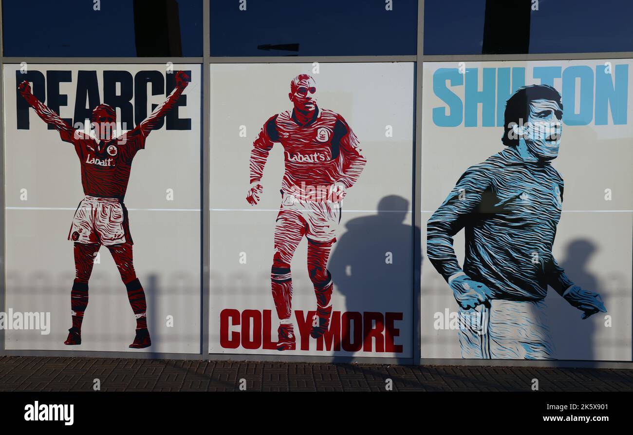 Nottingham, England, 10th October 2022.  A fan casts his shadow onto pictures of former Nottingham Forest players before the Premier League match at the City Ground, Nottingham. Picture credit should read: Darren Staples / Sportimage Stock Photo