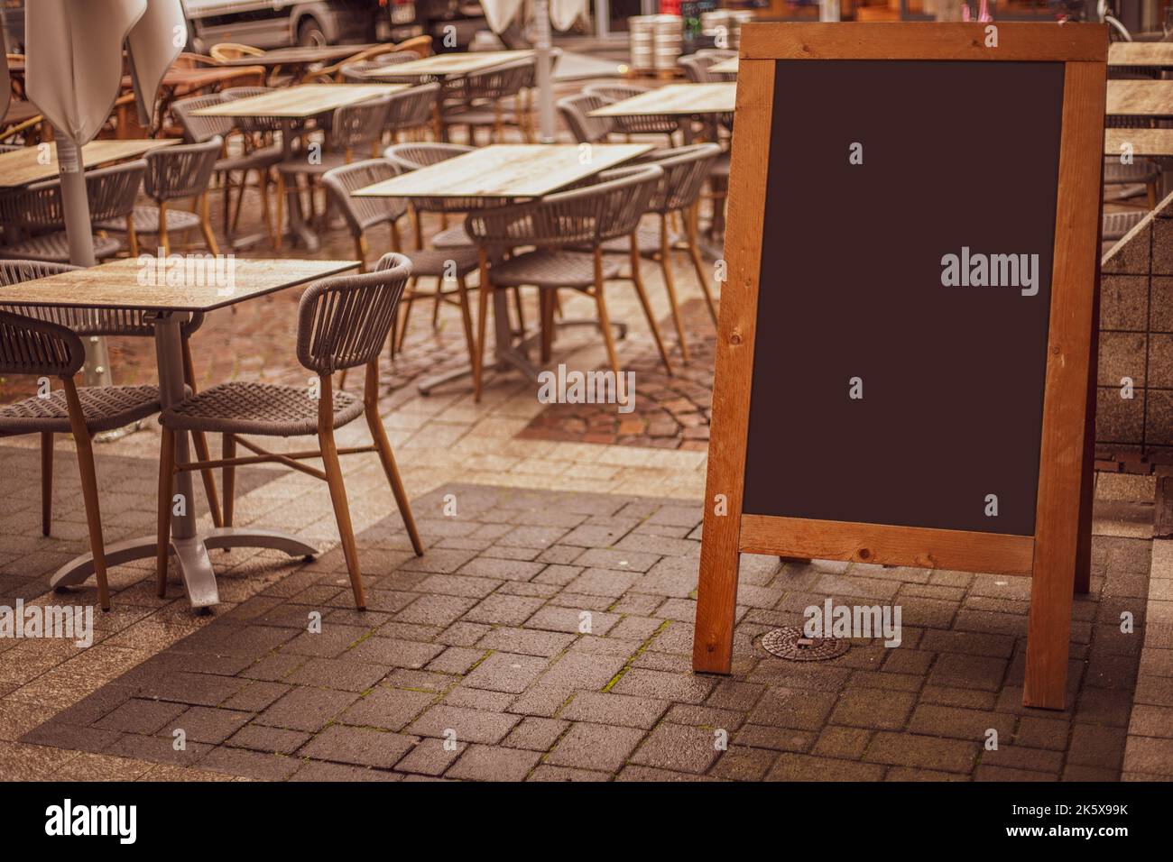 Empty sandwich chalkboard stand on a street ready to be filled Stock