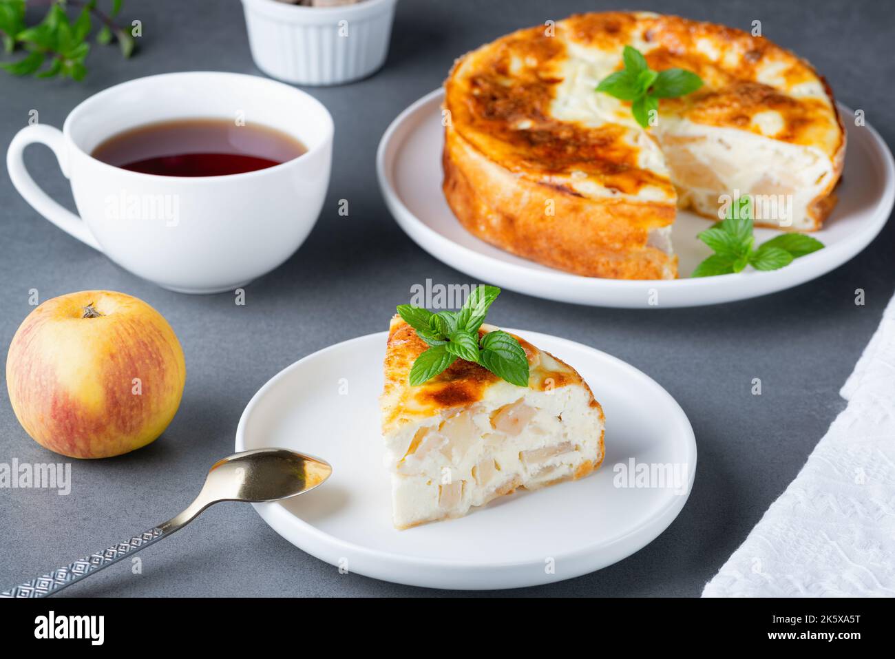 Baked Sweet Cottage Cheese casserole with apple decorated mint Stock Photo