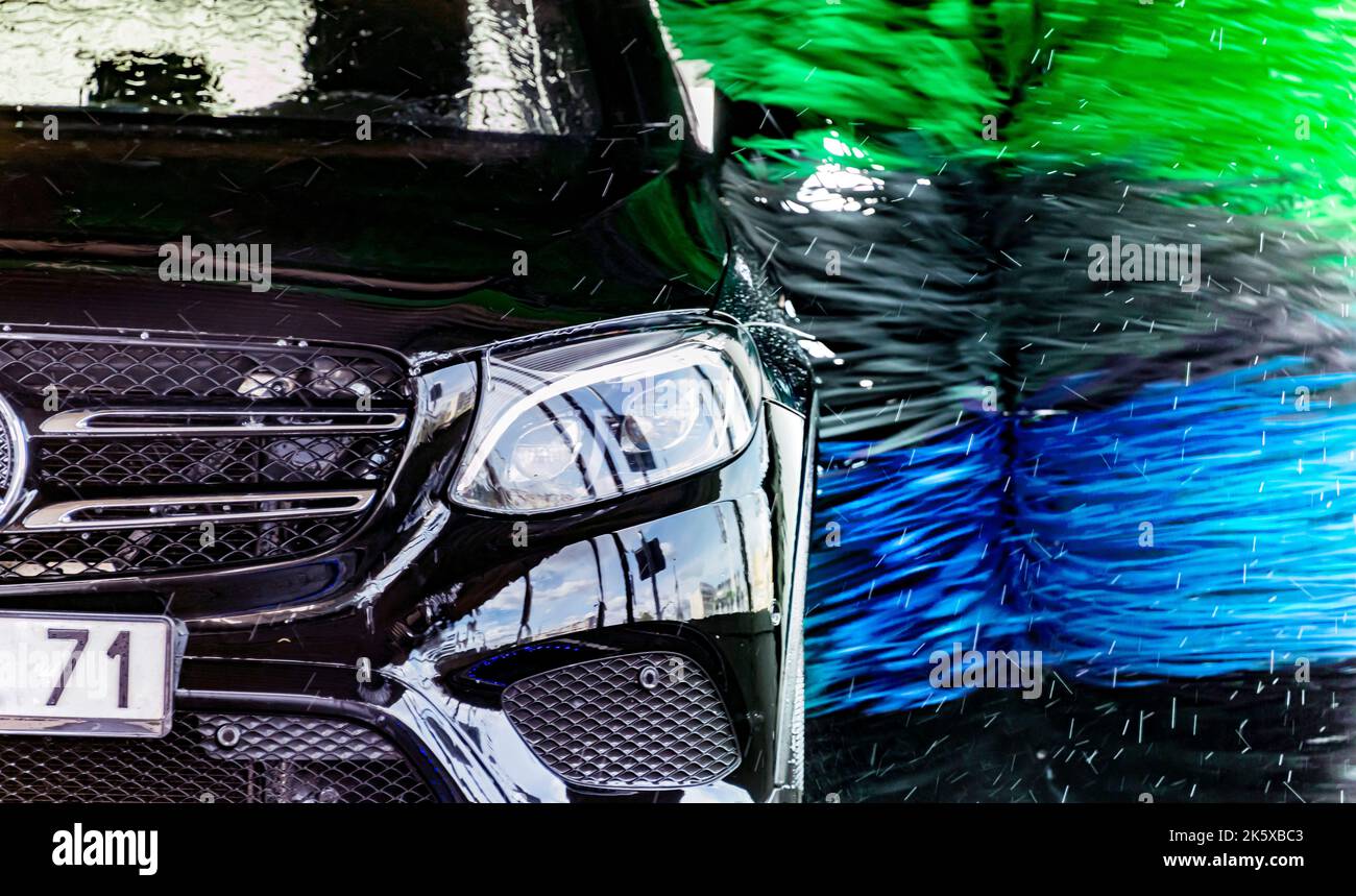 A vehicle in an automatic car wash. Stock Photo