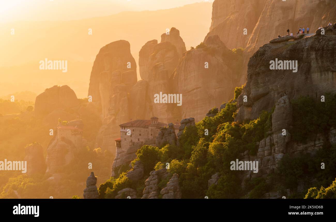 Landscape view of the Meteora rock mountain formations in the Pindos Mountains, Greece, during sunset. Stock Photo