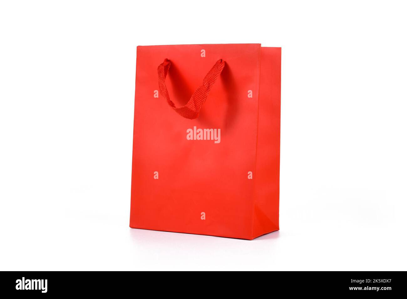 Red paper shopping gift bag on white background Stock Photo