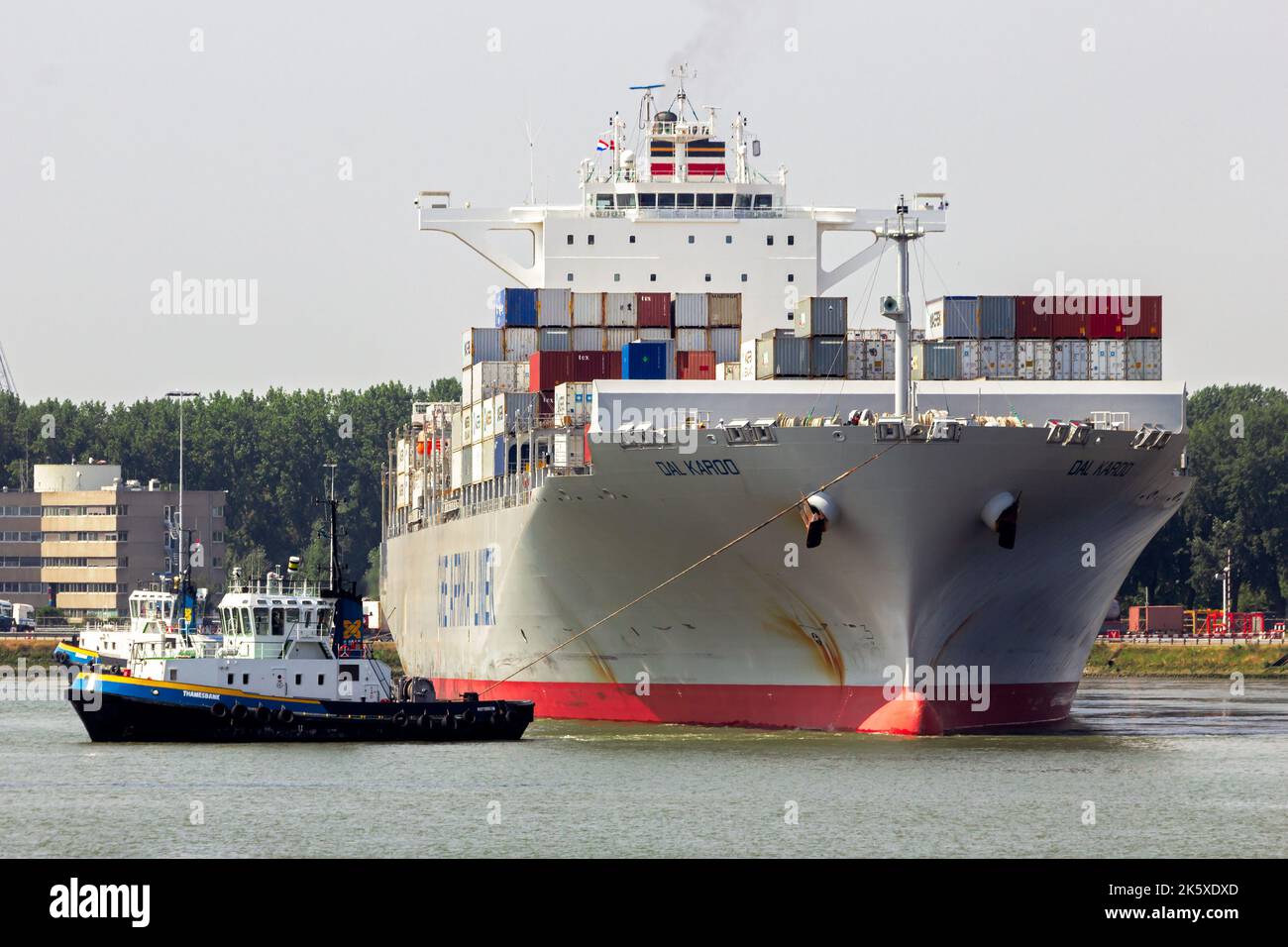 Container ship from Deutsche Afrika-Linien being towed in the Port of Rotterdam, The Netherlands - August 1, 2014. Stock Photo