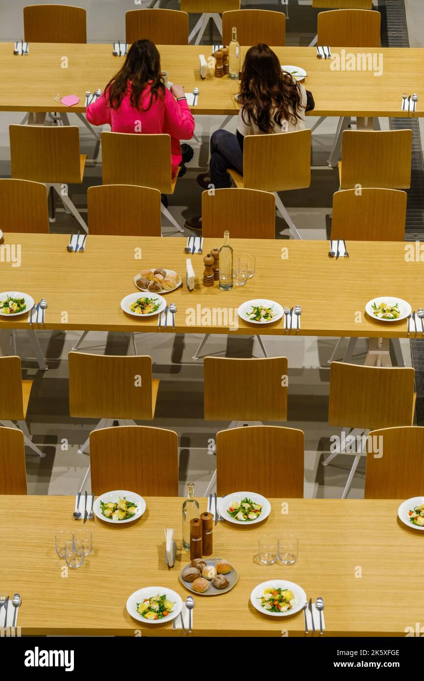 Women eating served dinner in canteen Stock Photo Alamy