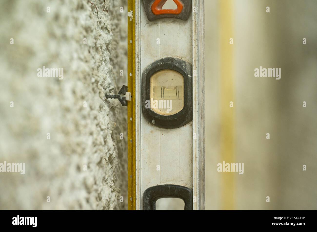 The man checks the attached guide beacon for equality with the help of ...