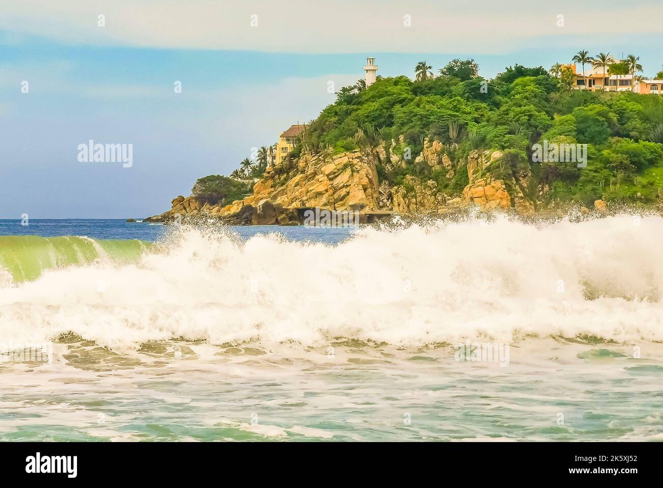 Extremely huge big surfer waves with cliffs rocks boulders stones at ...