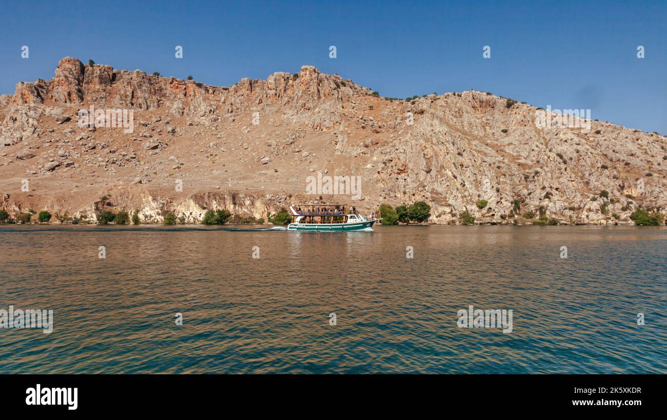Touristic boat trip on the lake in the historical Halfeti district. Halfeti, Urfa, Turkey Stock Photo