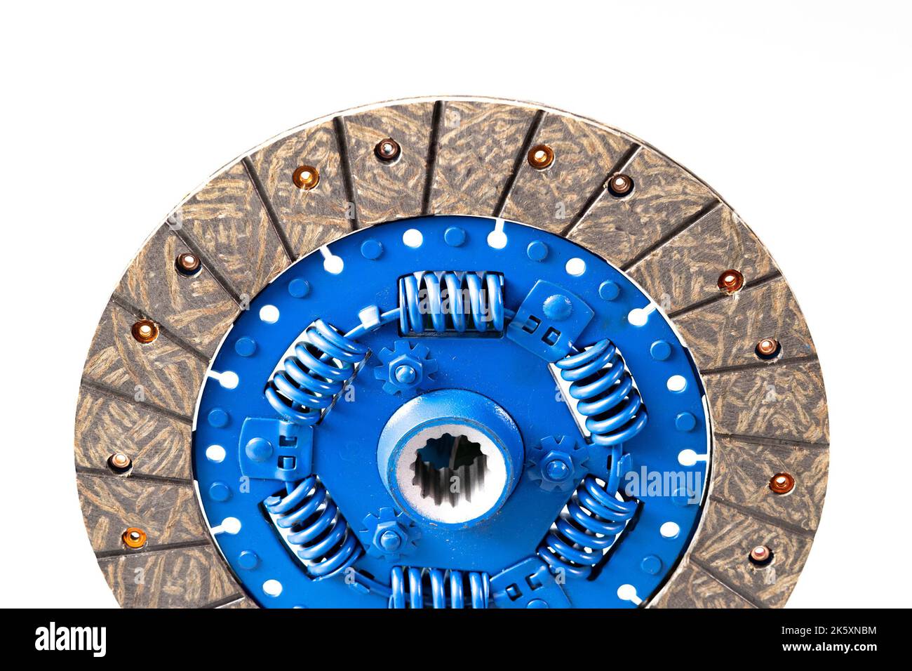 New car clutch plate isolated on white. Blue central part of clutch with springs and new