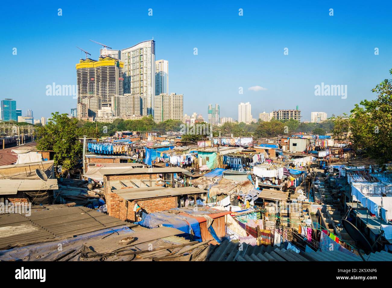 Mumbai, India. High rise buildings next to a slum neighborhood Stock Photo