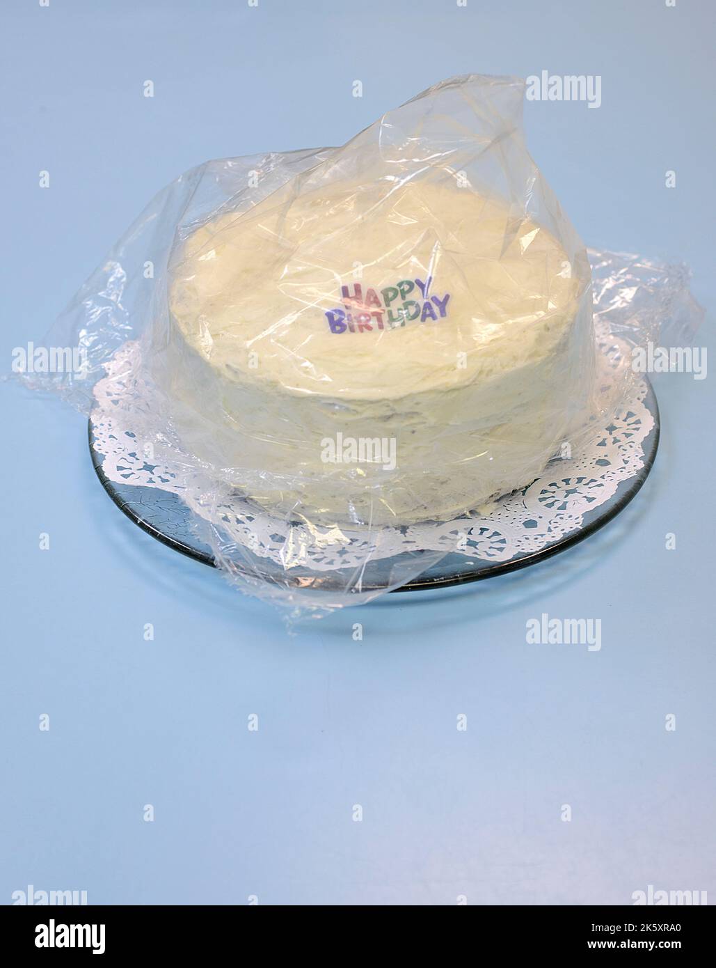 Birthday Cake covered with Plastic Wrapping Stock Photo