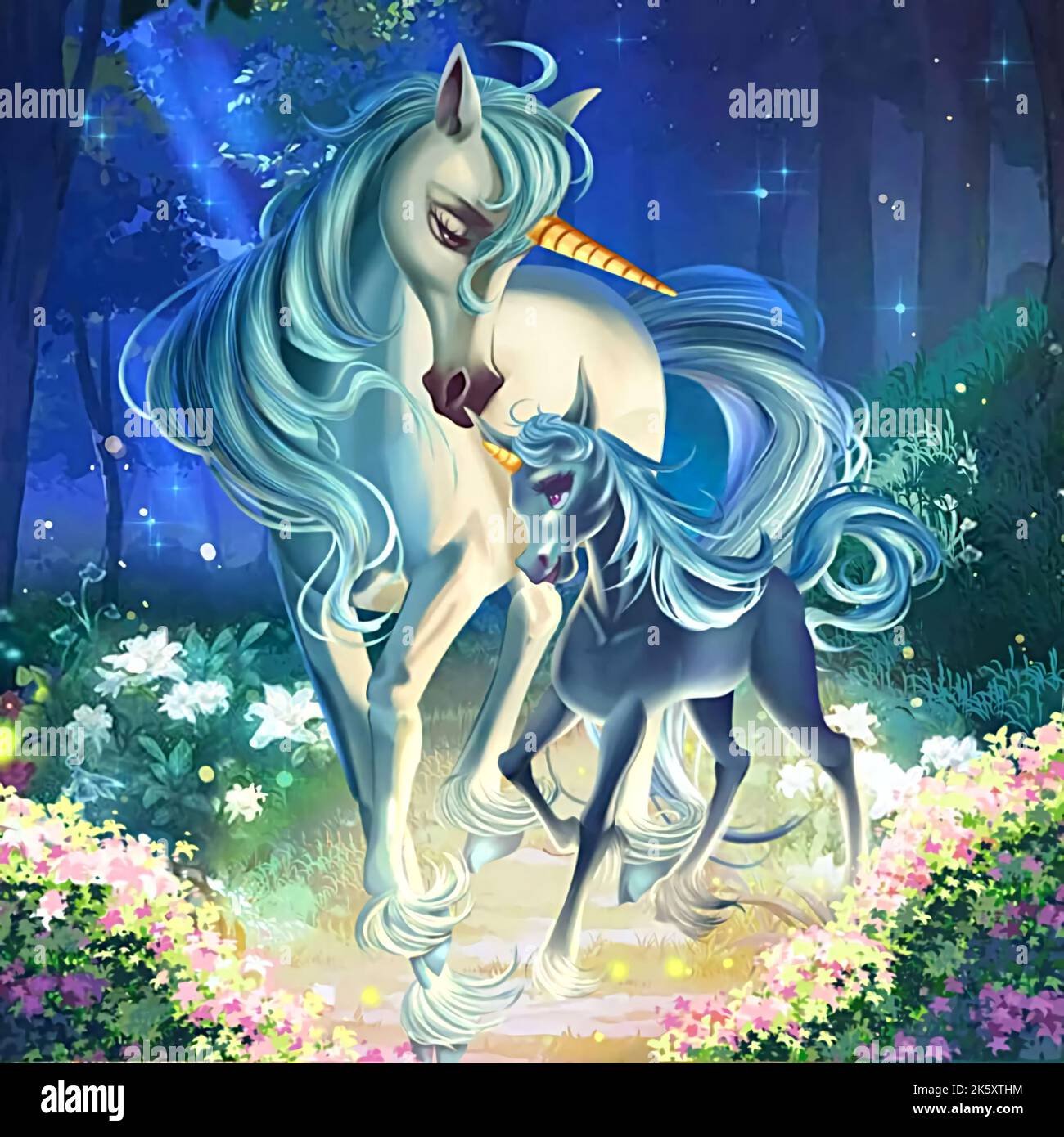 picture of two white unicorns in a flower garden at night Stock Photo