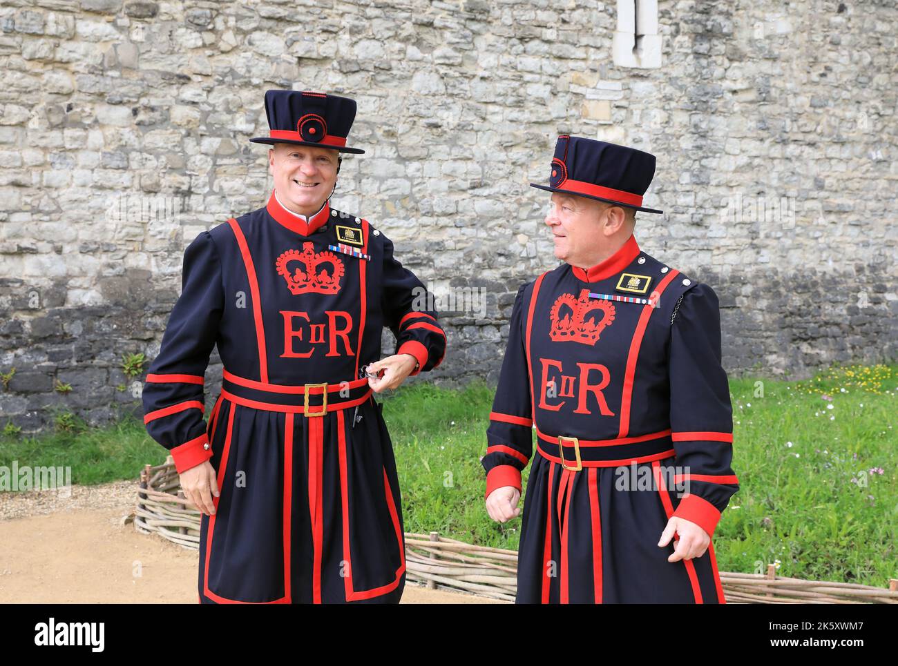 Yeomen of the Guard, or 'Beefeaters' at the Tower of London, who take guided tours around and share fascinating stories of the 1000 years of history. Stock Photo