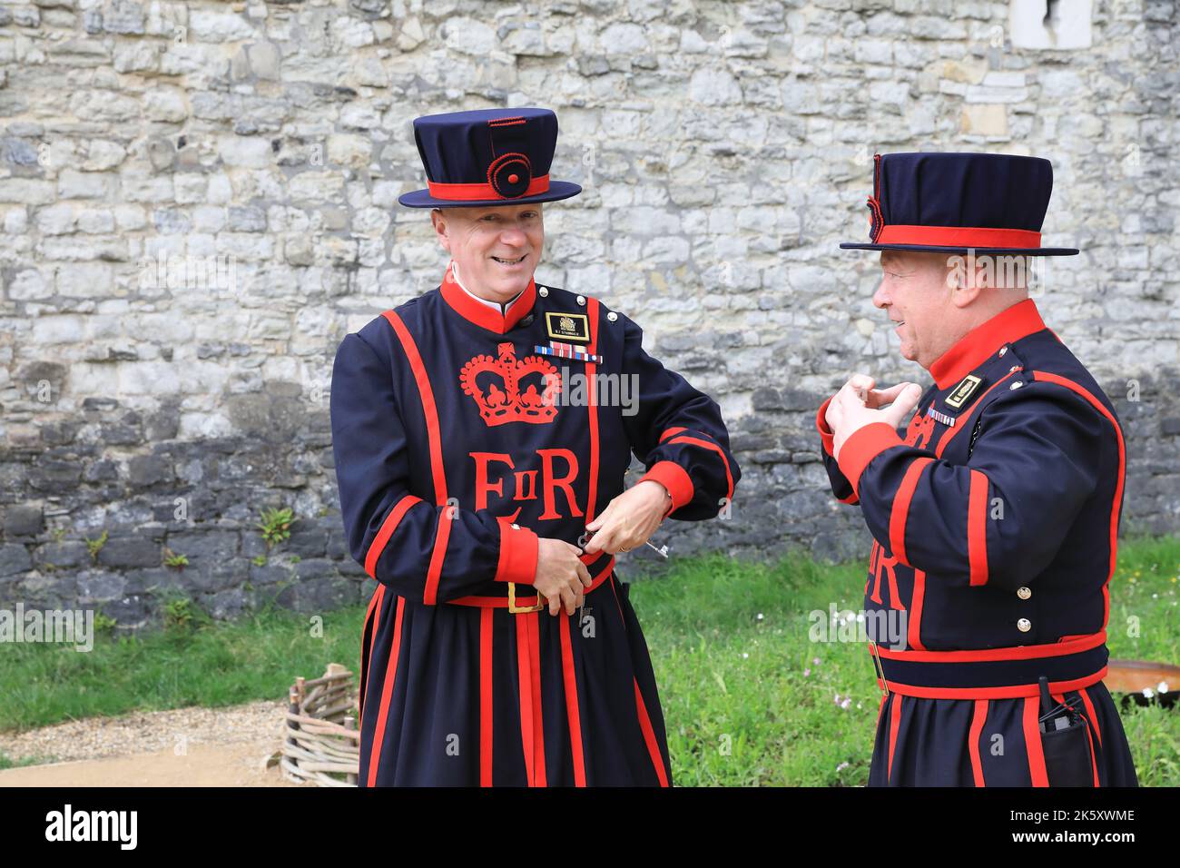 Yeomen of the Guard, or 'Beefeaters' at the Tower of London, who take guided tours around and share fascinating stories of the 1000 years of history. Stock Photo
